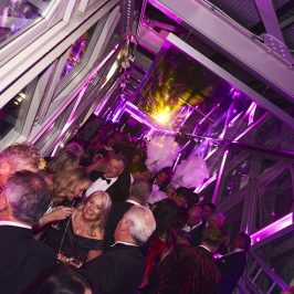 Crowd of people in smart dress at the West High Level Walkway at Tower Bridge